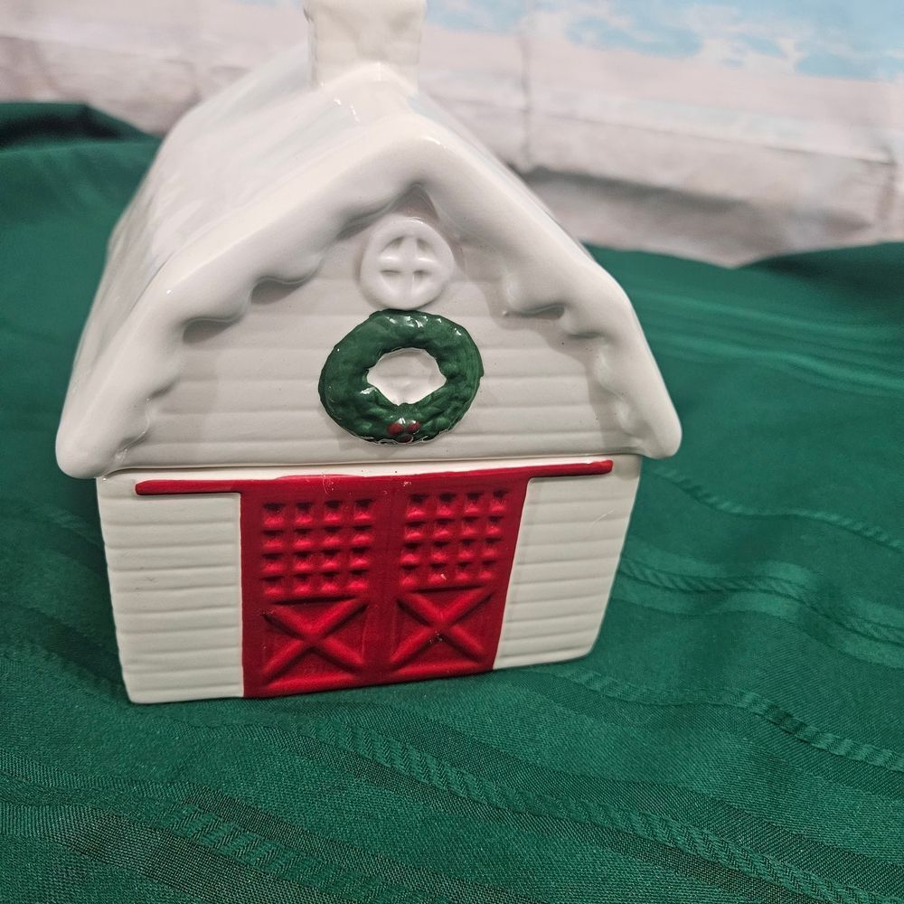 Cookie And Treat Jar In A Ceramic Barn with Red Doors And Green Wreath